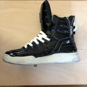 Patent leather high top sneaker.